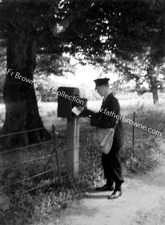 POSTMAN AT LETTERBOX